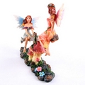 Cute Flower Fairies Playing on Seesaw Figurine